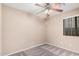 Bedroom with carpeting, ceiling fan, and natural light from window at 3719 W Carson Rd, Phoenix, AZ 85041