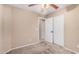 Neutral bedroom with a ceiling fan and closet space, creating a serene environment at 3719 W Carson Rd, Phoenix, AZ 85041