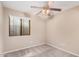 Bright bedroom with a large window and ceiling fan; perfect for relaxation at 3719 W Carson Rd, Phoenix, AZ 85041