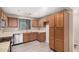 Charming kitchen featuring wood cabinets, stainless steel appliances and modern flooring at 3719 W Carson Rd, Phoenix, AZ 85041