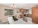 Eat-in kitchen with stainless steel appliances, tile flooring, and bright lighting at 3719 W Carson Rd, Phoenix, AZ 85041