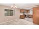 Bright dining area open to kitchen featuring stainless steel appliances and wood cabinets at 3719 W Carson Rd, Phoenix, AZ 85041