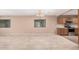 Bright living room open to the kitchen with stainless steel appliances and wood cabinets at 3719 W Carson Rd, Phoenix, AZ 85041