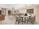 Bright living room with neutral tones, open floor plan, and sliding glass door to outdoor space at 3719 W Carson Rd, Phoenix, AZ 85041