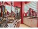 Unique bathroom with red walls, glass block window, and dual vanities at 40635 N 109Th Pl # 3 & 5, Scottsdale, AZ 85262