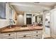Bathroom featuring granite counters, a large mirror, and white cabinets at 40635 N 109Th Pl # 3 & 5, Scottsdale, AZ 85262
