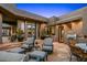 Expansive outdoor stone patio with seating, grill and desert views at 40635 N 109Th Pl # 3 & 5, Scottsdale, AZ 85262