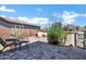Serene backyard patio with stylish pavers, a fire pit, and desert plants at 41215 N Lytham Ct, Phoenix, AZ 85086