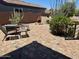 Cozy backyard area with patio seating and a charming outdoor fireplace at 41215 N Lytham Ct, Phoenix, AZ 85086