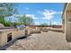 Outdoor patio area with outdoor kitchen, grill, bar, seating and fire pit for entertaining at 41215 N Lytham Ct, Phoenix, AZ 85086