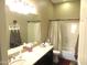 Bathroom with a sink, vanity, mirror, shower, and toilet in a neutral palette at 41215 N Lytham Ct, Phoenix, AZ 85086