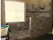 Modern walk-in shower with stone pebble flooring, glass enclosure, and a large window for natural light at 41215 N Lytham Ct, Phoenix, AZ 85086