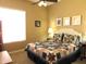 Cozy bedroom featuring a comfortable bed, side tables, and large windows at 41215 N Lytham Ct, Phoenix, AZ 85086