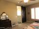 Serene bedroom with a decorative sliding door, offering a tranquil and private retreat at 41215 N Lytham Ct, Phoenix, AZ 85086