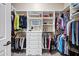 Walk-in closet with custom shelves and clothing racks at 41215 N Lytham Ct, Phoenix, AZ 85086