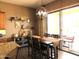 Cozy dining area adjacent to the kitchen with a sliding door offering outdoor access at 41215 N Lytham Ct, Phoenix, AZ 85086