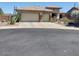 Charming single-story home with a well-maintained front yard and a convenient two-car garage at 41215 N Lytham Ct, Phoenix, AZ 85086