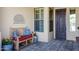 Cozy front porch with a bench and plants near the front door at 41215 N Lytham Ct, Phoenix, AZ 85086