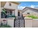 Welcoming front entryway with a stylish gate and a cozy seating area at 41215 N Lytham Ct, Phoenix, AZ 85086