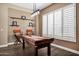 A game room with a pool table, industrial lighting, hardwood floors, and white plantation shutters at 41215 N Lytham Ct, Phoenix, AZ 85086