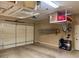 Spacious garage featuring an automatic door and overhead storage racks at 41215 N Lytham Ct, Phoenix, AZ 85086
