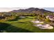 Expansive golf course showcasing well-maintained fairways, sand traps, and surrounding neighborhood at 41215 N Lytham Ct, Phoenix, AZ 85086
