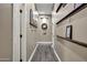 Hallway with decorative shelving and doors, enhancing the home's interior design at 41215 N Lytham Ct, Phoenix, AZ 85086