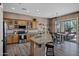 A modern kitchen with granite countertops, stainless steel appliances, and access to a back yard at 41215 N Lytham Ct, Phoenix, AZ 85086