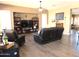 Comfortable living room with stylish furnishings, a large TV, and plenty of space for entertaining at 41215 N Lytham Ct, Phoenix, AZ 85086