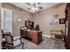 Comfortable office space with natural light, a ceiling fan, and wood floors at 41215 N Lytham Ct, Phoenix, AZ 85086