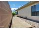 Side yard featuring decorative rock, mature landscaping and an area perfect for relaxing and entertaining at 41215 N Lytham Ct, Phoenix, AZ 85086