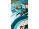 Exciting water slide winding through lush greenery, offering summer fun for residents at 41215 N Lytham Ct, Phoenix, AZ 85086