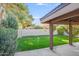 Spacious backyard with lush green grass and a covered patio area at 4525 N 66Th St # 95, Scottsdale, AZ 85251