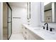 Bright bathroom featuring white cabinetry, marble countertops, and a glass enclosed shower at 4525 N 66Th St # 95, Scottsdale, AZ 85251
