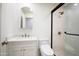 Modern bathroom with walk-in shower, tiled walls, and single sink vanity at 4525 N 66Th St # 95, Scottsdale, AZ 85251