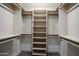 Organized closet with shelving and hanging rods at 4525 N 66Th St # 95, Scottsdale, AZ 85251