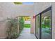 View of a landscaped courtyard with a walkway and mature plants at 4525 N 66Th St # 95, Scottsdale, AZ 85251