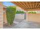 A welcoming entrance features a gated courtyard and a well-maintained landscape with a decorative bush at 4525 N 66Th St # 95, Scottsdale, AZ 85251