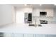 Updated kitchen with stone countertops, stainless steel appliances, and white cabinetry at 4525 N 66Th St # 95, Scottsdale, AZ 85251