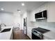 Updated kitchen with stainless steel appliances and white cabinetry at 4525 N 66Th St # 95, Scottsdale, AZ 85251