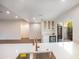 Bright and modern kitchen featuring stone countertops, stainless steel sink and a courtyard view at 4525 N 66Th St # 95, Scottsdale, AZ 85251