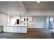 Open living space with hardwood flooring, stainless steel appliances, stone countertops and courtyard access at 4525 N 66Th St # 95, Scottsdale, AZ 85251