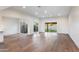 Open living space with hardwood flooring and sliding glass doors with access to backyard and courtyard at 4525 N 66Th St # 95, Scottsdale, AZ 85251