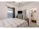Bedroom featuring a window with natural light leading to the bathroom and closet at 4595 W Foldwing Dr, San Tan Valley, AZ 85144