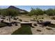 A community park with shade trees, seating, and a well-maintained green space at 4595 W Foldwing Dr, San Tan Valley, AZ 85144