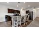Kitchen with granite countertops, stainless steel appliances, and an island with bar seating at 4595 W Foldwing Dr, San Tan Valley, AZ 85144