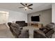 An open living room featuring modern decor, neutral colors, and comfortable seating at 4595 W Foldwing Dr, San Tan Valley, AZ 85144