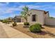 Street view showing the home's desert landscaping, and well-maintained sidewalk at 4595 W Foldwing Dr, San Tan Valley, AZ 85144