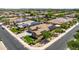 Beautiful aerial view of a home with solar panels in a friendly neighborhood at 4721 N Aldea W Rd, Litchfield Park, AZ 85340