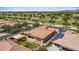 View of a home with solar panels across from green community space at 4721 N Aldea W Rd, Litchfield Park, AZ 85340